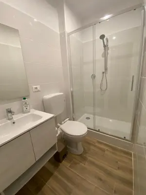 a bathroom with a shower and a toilet and a sink at Joyful Home in Rome