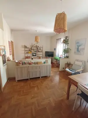 a living room with a wooden floor at Casa Bambù in Rome