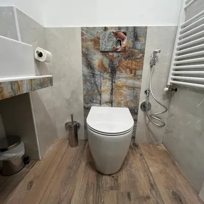 a bathroom with a toilet and a shower at Ele Suites Pantheon in Rome