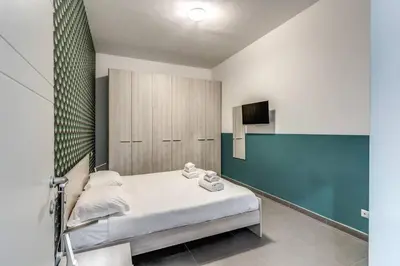 a hospital room with a bed and a tv at New Flat Near Termini Station in Rome
