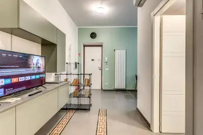 a living room with a tv and a large screen at New Flat Near Termini Station in Rome
