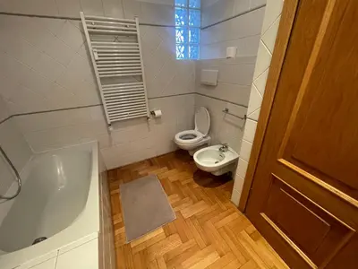 a bathroom with a toilet and a tub and a sink at A due passi da San Pietro in Rome