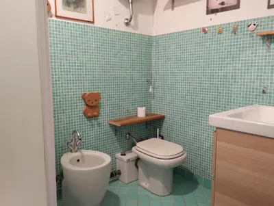 a bathroom with a toilet and a sink at La Dimora Torlonia Elegance & light in Rome in Rome