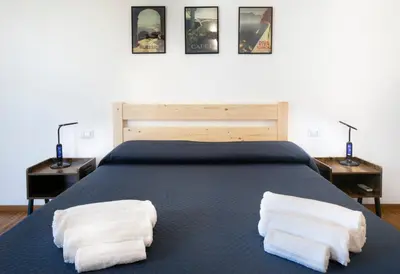 a bedroom with a bed with two towels on it at Cozy flat 2 bedrooms 2 bathrooms with balcony in Rome