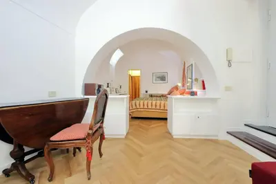 a living room with a piano and a bedroom at Pantheon Apartment with private terrace in Rome