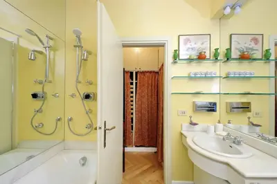 a bathroom with a shower and a sink and a tub at Pantheon Apartment with private terrace in Rome