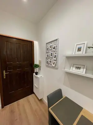 a room with a door and a table and a chair at Elian Apartament In The Center of Rome #2 in Rome