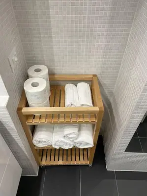a small bathroom with towels and toilet paper at Elian Apartament In The Center of Rome #2 in Rome