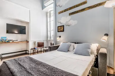 a bedroom with a large bed in a room at Vatican Blue Sky in Rome