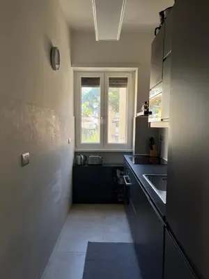 a kitchen with a sink and a window at Moderno bilocale con terrazzo in Rome