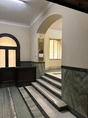 a lobby with stairs and an archway at Vatican Tiny House in Rome
