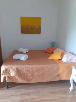 a bed with two pillows on it in a room at Loft Shabby Chic con vista vicino al Vaticano in Rome
