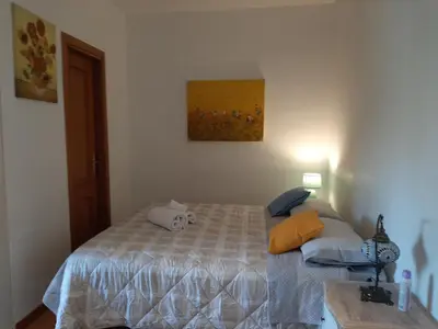 a bedroom with a bed with a stuffed animal on it at Loft Shabby Chic con vista vicino al Vaticano in Rome