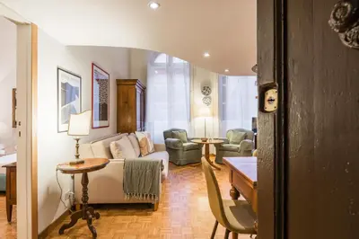 a living room with a couch and a table at Carla Luxury House in Rome