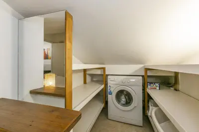 a small laundry room with a washer and dryer at Trevi Little Palace #9 in Rome
