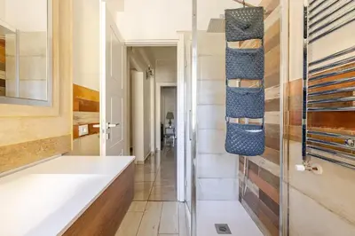 a bathroom with a white tub and a sink at Casa Caterina - Modern design apartment near Vatican City in Rome
