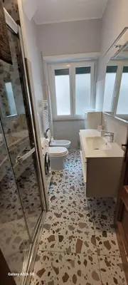 a bathroom with a toilet and a sink and a shower at Tra le antiche mura e Garbatella in Rome