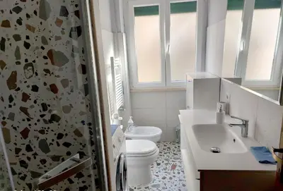 a bathroom with a toilet and a sink and a shower at Tra le antiche mura e Garbatella in Rome