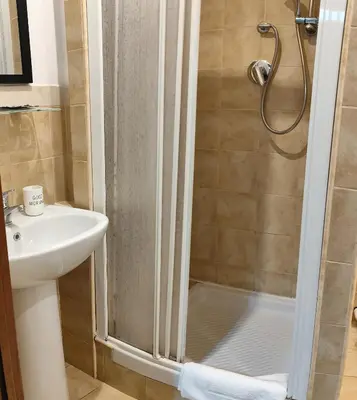 a bathroom with a shower and a sink at Vaticano San Pietro metro ottaviano in Rome