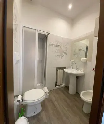 a bathroom with a toilet and a sink at Vaticano San Pietro metro ottaviano in Rome
