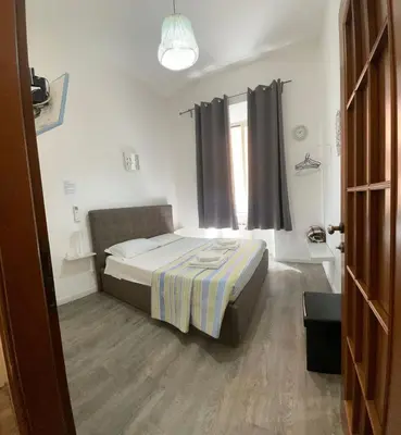 a small bedroom with a bed and a window at Vaticano San Pietro metro ottaviano in Rome