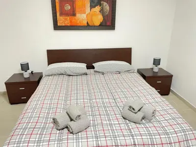 a bedroom with a bed with two pillows on it at BORGO PESCI in Rome