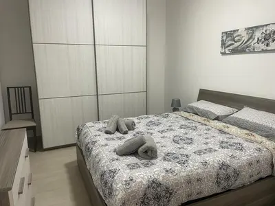a bedroom with a bed with two towels on it at BORGO PESCI in Rome