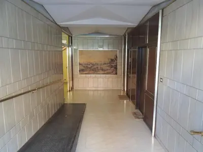 a hallway of a building with a painting on the wall at Casa Felicita in Rome