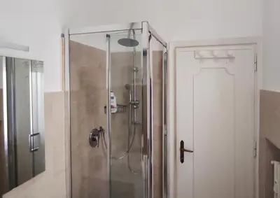 a shower with a glass door in a bathroom at La Casa di Dany in Rome
