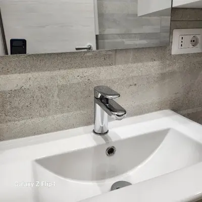 a white sink with a faucet in a bathroom at SweetHouseVittorio in Rome