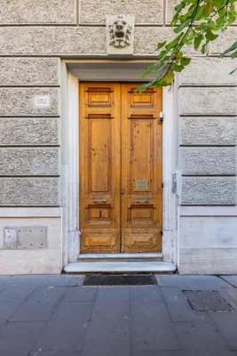 a wooden door on the side of a building at Little Gaia Suite in Rome