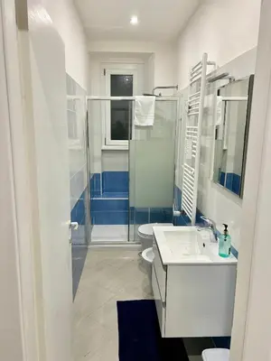 a bathroom with a shower and a sink and a toilet at Roma Apartment holiday in Rome