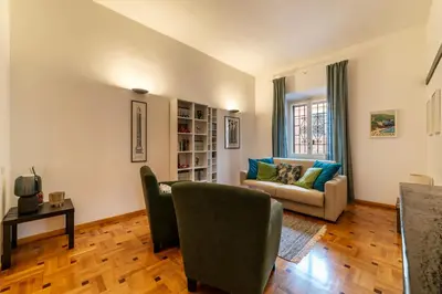 a living room with a couch and a chair at GuestHost - Trastevere Delightful Apartment in Rome