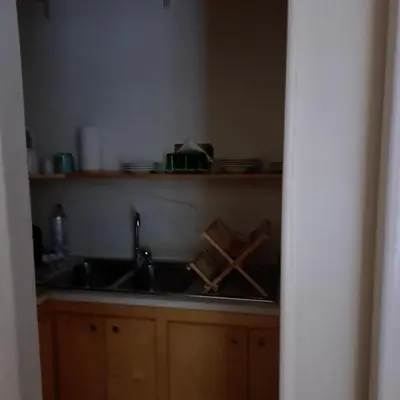 a kitchen with a sink and a counter top at HOUSE UP TO THE HILL - stanza con soggiorno a Monteverde vecchio in Rome