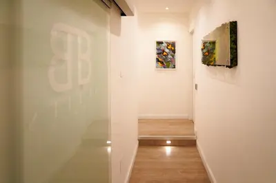 a hallway with two paintings on a wall at Ripetta Boutique Suites in Rome