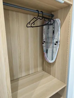 a closet with a mirror in a wooden cabinet at Casa Aventino in Rome