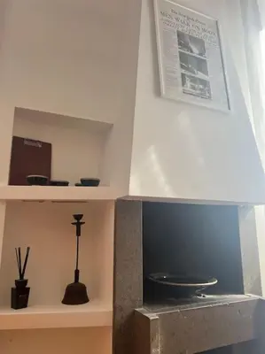 a room with a shelf with a sink and a plate at Scarpetta32 - Your home in Trastevere in Rome
