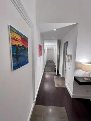 a hallway of a home with a painting on the wall at B&B Azuni Home in Rome