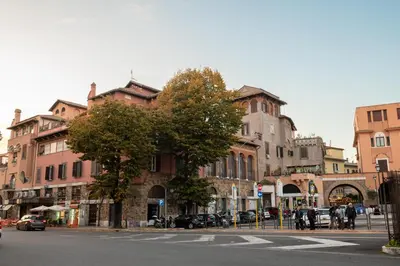 a street with buildings and a tree on a city street at Guest house Sempione da Giulio in Rome