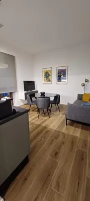 a living room with a couch and a table at MT apartment in Rome