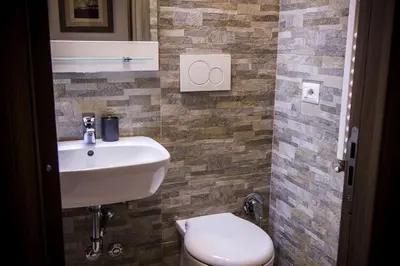 a bathroom with a sink and a toilet at Colossehome - Dream House around the corner from Colosseum in Rome