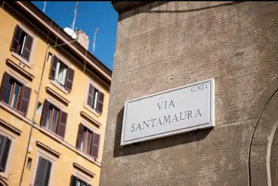 a sign on the side of a building at 1 Minute from San Pietro - Nicole House in Rome