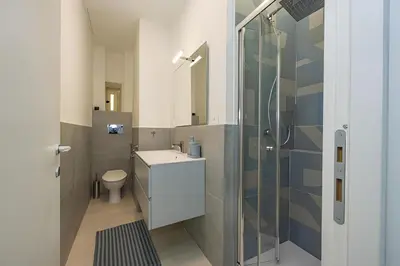 a bathroom with a shower and a sink and a toilet at 1 Minute from San Pietro - Nicole House in Rome