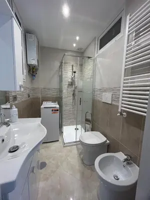 a bathroom with a sink and a toilet and a shower at Claire House in Rome
