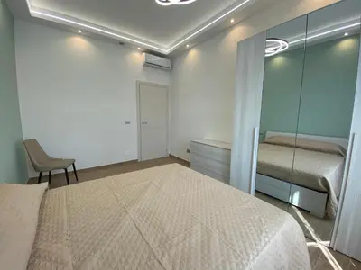 a bedroom with a bed and a glass wall at Claire House in Rome