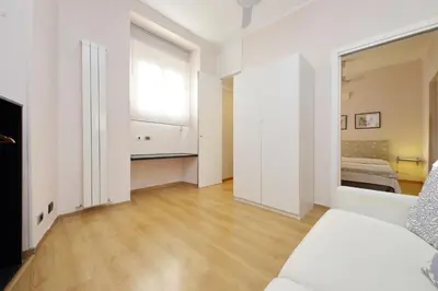 an empty living room with a couch and a window at Vaticano in Rome
