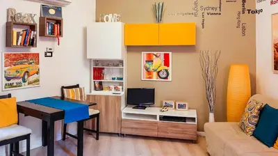 a living room with a desk with a television and a couch at Casa Federico - beauty apartment with wonderful terrace in Rome