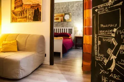 a living room with a couch and a chalkboard at Casa Federico - beauty apartment with wonderful terrace in Rome
