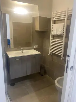 a bathroom with a sink and a toilet at New opening Sweet Apartament Trastevere in Rome
