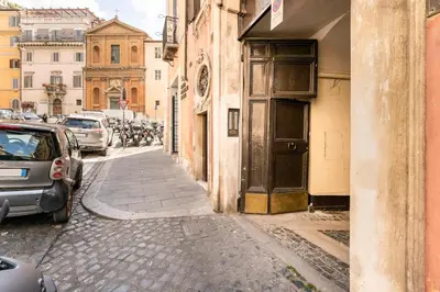 a narrow alley with cars parked on the street at Palazzo Centini Toni - Rome with style in Rome